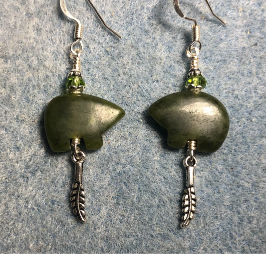 Green jadeite gemstone Zuni bear fetish bear earrings adorned with green crystal beads and tiny silver feather charms.