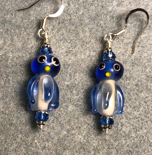 Translucent blue and white lamp work jellyfish bead earrings adorned with blue Chinese crystal beads.