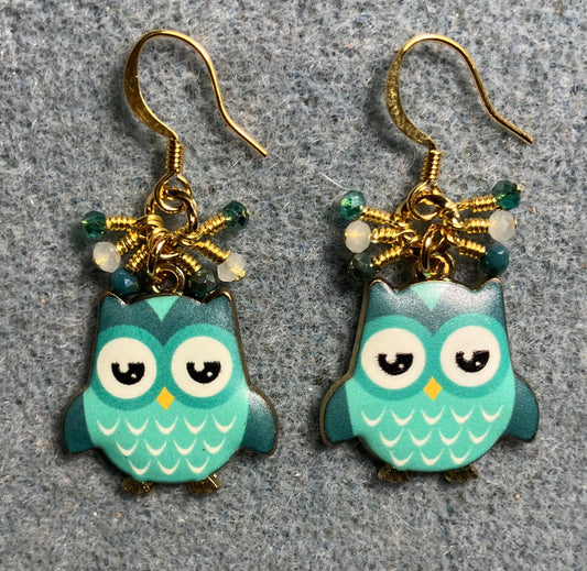 Teal and white enamel owl charm earrings adorned with tiny dangling teal and white Chinese crystal beads.