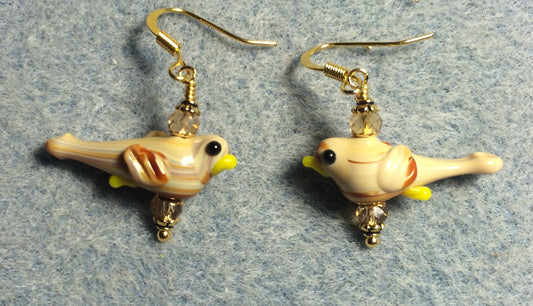 Small tan lamp work songbird bead earrings adorned with tan Chinese crystal beads.