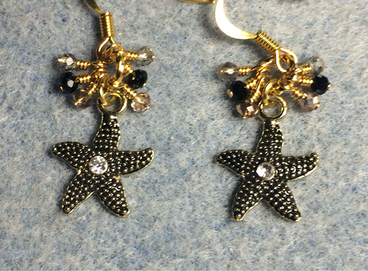 Black and gold enamel starfish charm earrings adorned with tiny dangling black, gold, and clear Chinese crystal beads.