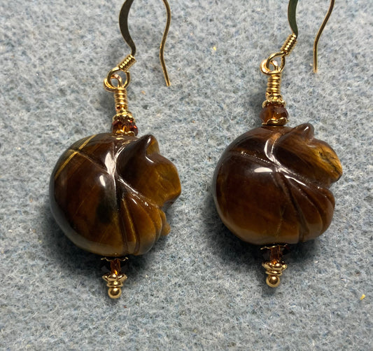 Tigereye gemstone sleeping cat bead earrings adorned with dark amber Chinese crystal beads.