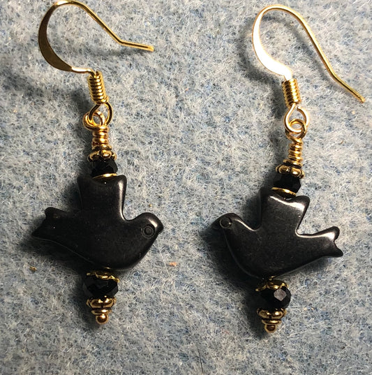 Black onyx gemstone flying dove bead earrings adorned with black Chinese crystal beads.