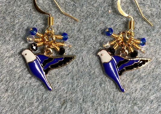 Dark blue, black, and white enamel parakeet charm earrings adorned with tiny dangling dark blue, black, and clear Chinese crystal beads.