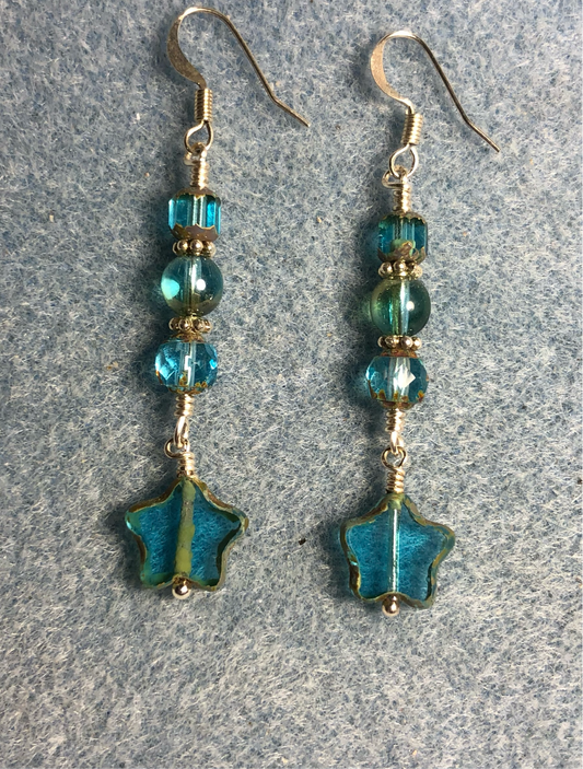 Small translucent turquoise green Czech glass star bead earrings adorned with turquoise green Czech glass beads.