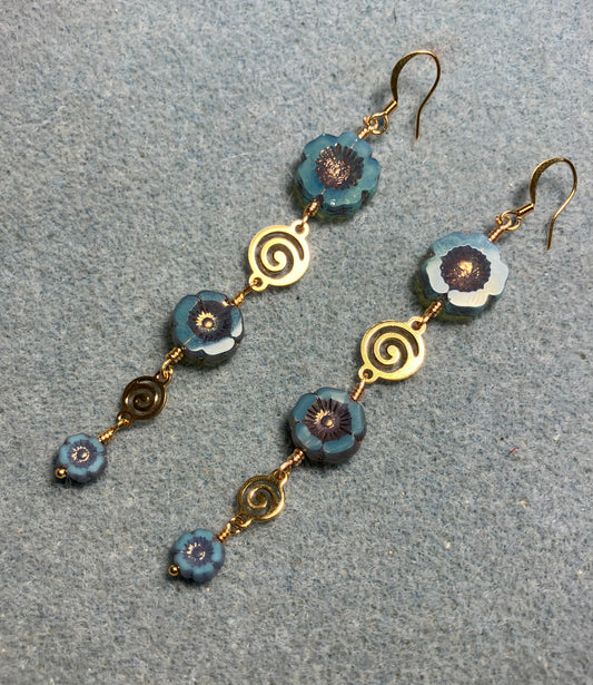 Extra long blue and copper flower bead earrings made with three sizes of blue and copper Czech glass pansy beads joined by gold swirly connectors.