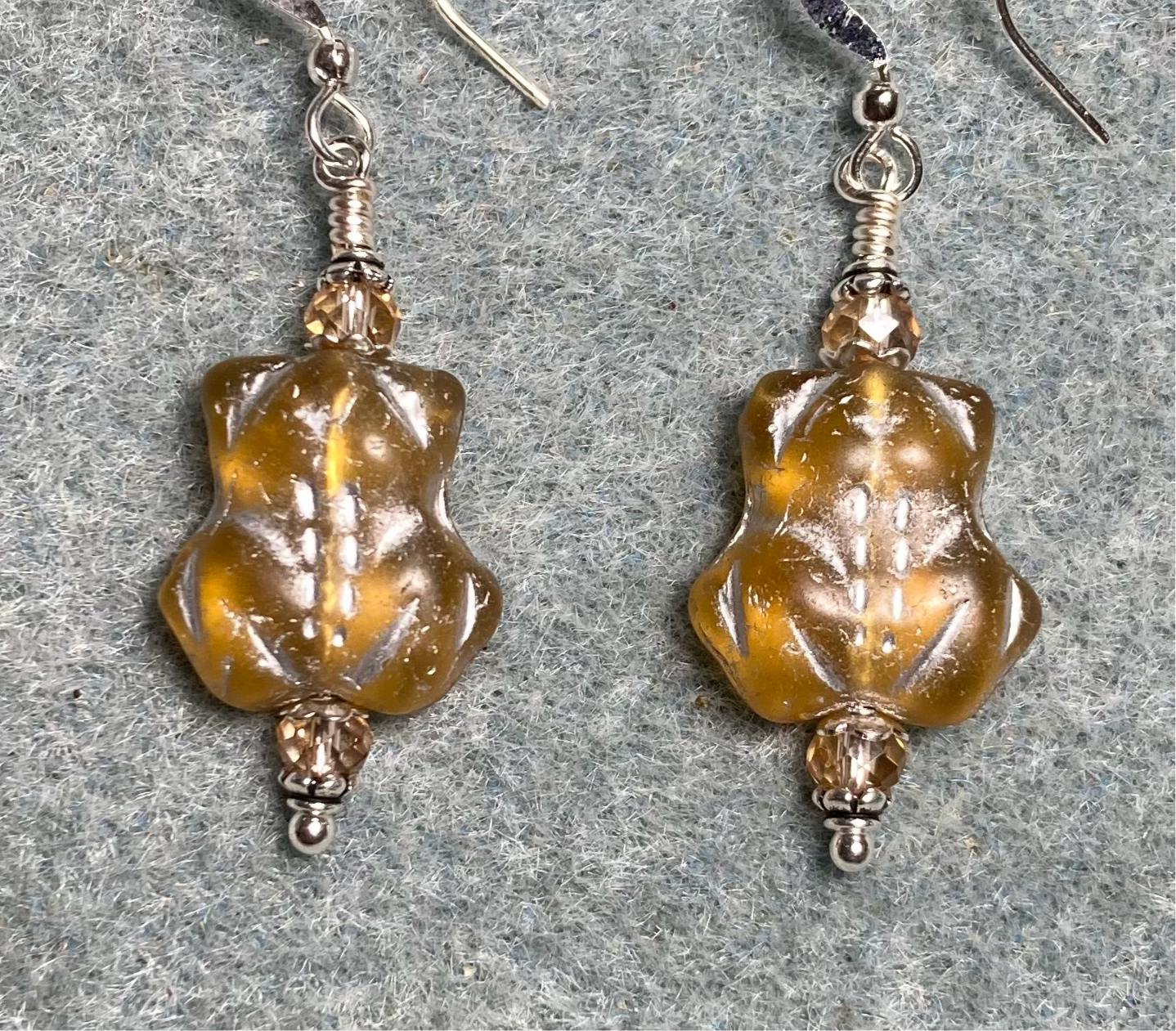 Translucent amber (with silver inlay) Czech glass turtle bead earrings adorned with amber Chinese crystal beads.