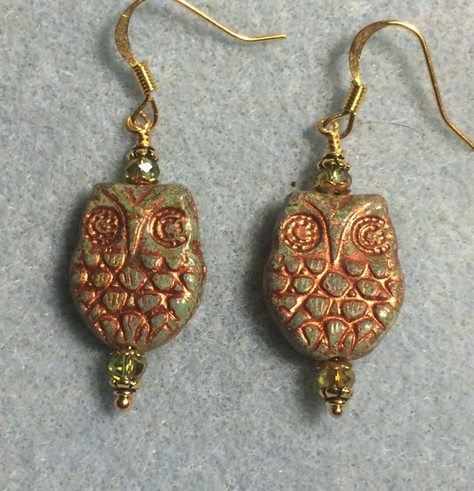 Olive green (with copper wash) Czech glass owl bead earrings adorned with sparkly olive green Chinese crystal beads.