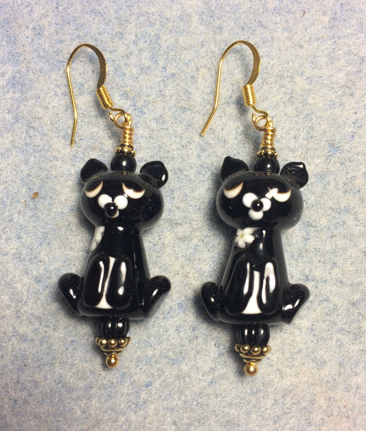 Opaque black lamp cat bead earrings adorned with black Czech glass beads.