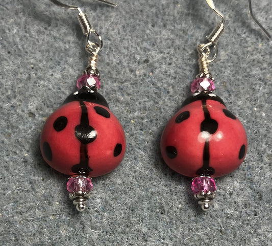 Rose pink and black ceramic ladybug bead earrings adorned with rose pink Chinese crystal beads.