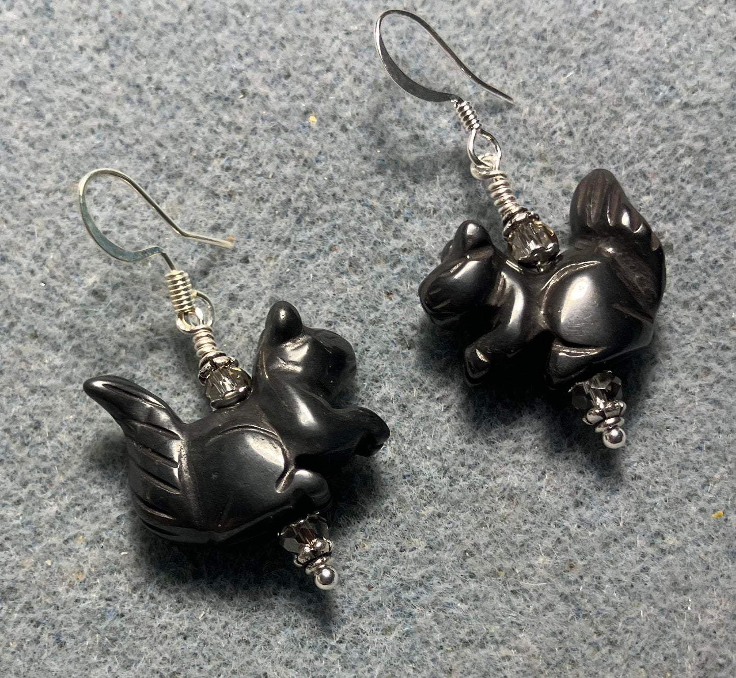 Gray hematite gemstone squirrel bead earrings adorned with gray Chinese crystal beads.