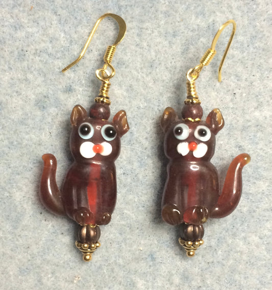 Translucent root beer brown lamp work cat bead earrings adorned with brown Czech glass beads.