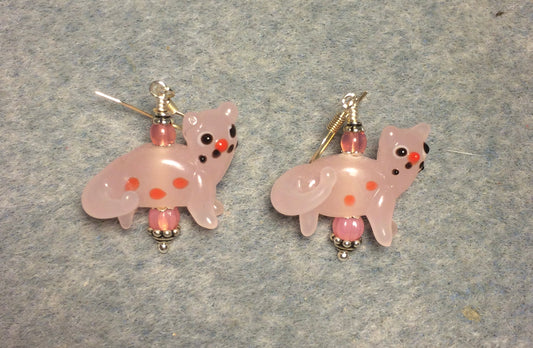 Milky pink lamp work spotted cat bead earrings adorned with milky pink Czech glass beads.