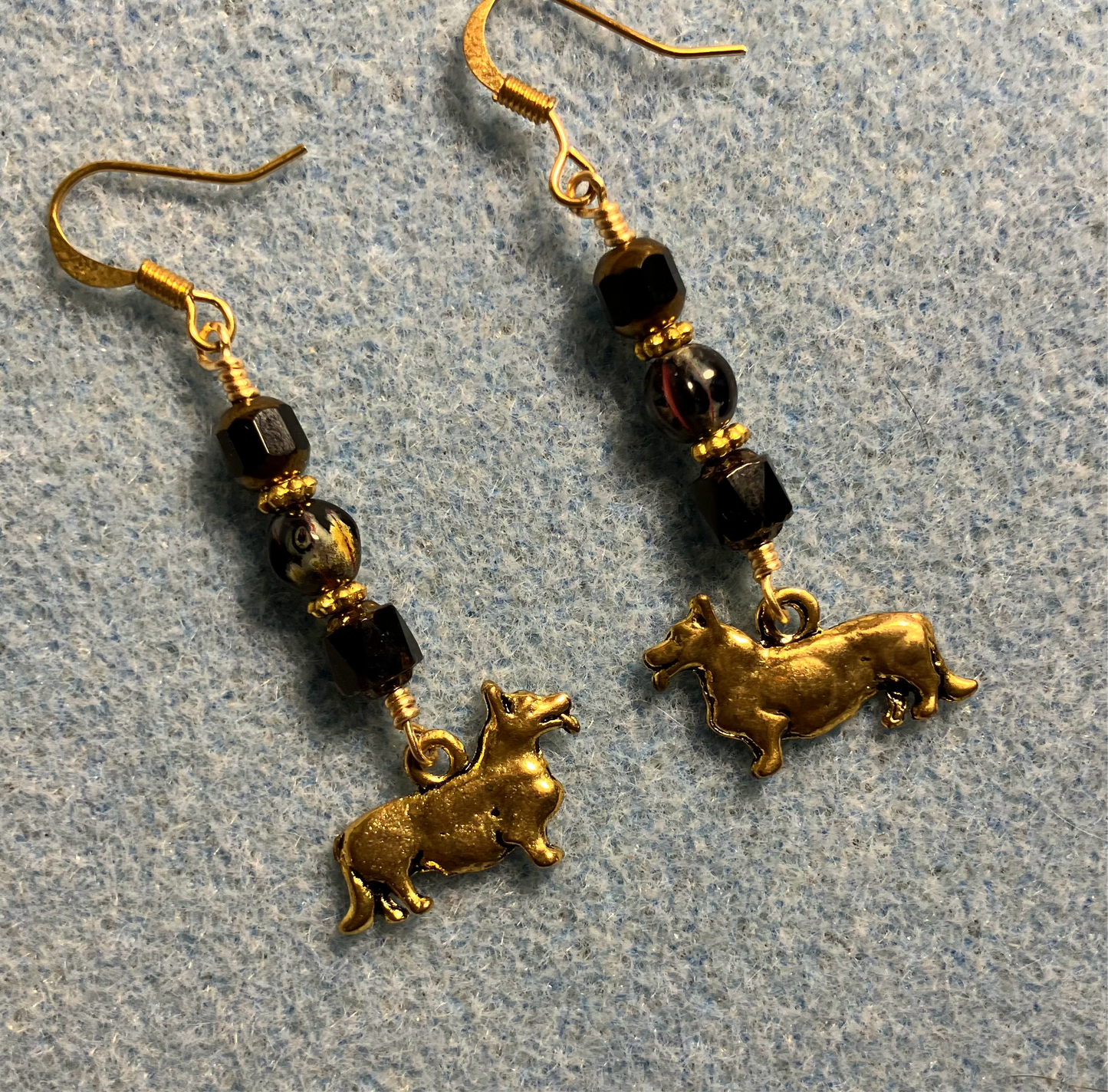 Gold corgi charm earrings adorned with black Czech glass beads