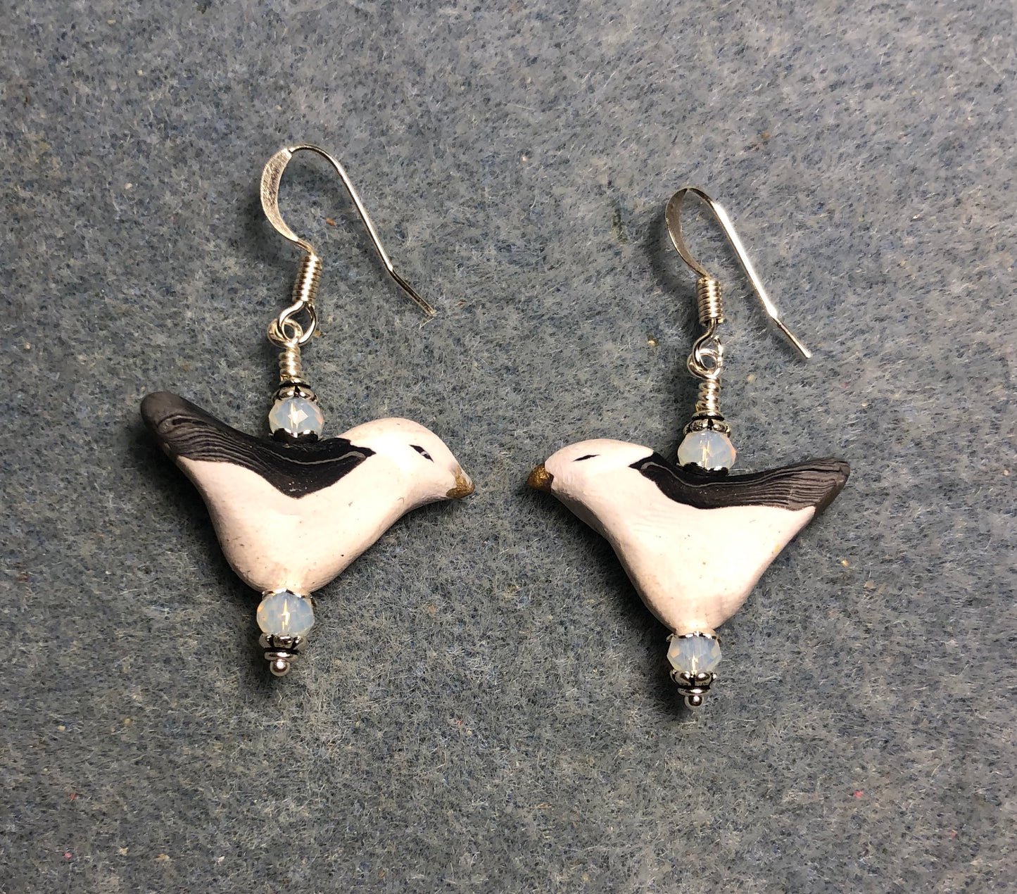 White and gray polymer clay seagull bead earrings adorned with white Chinese crystal beads.