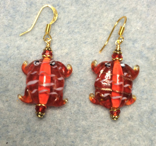 Red lamp work frog bead earrings adorned with red Chinese crystal beads.