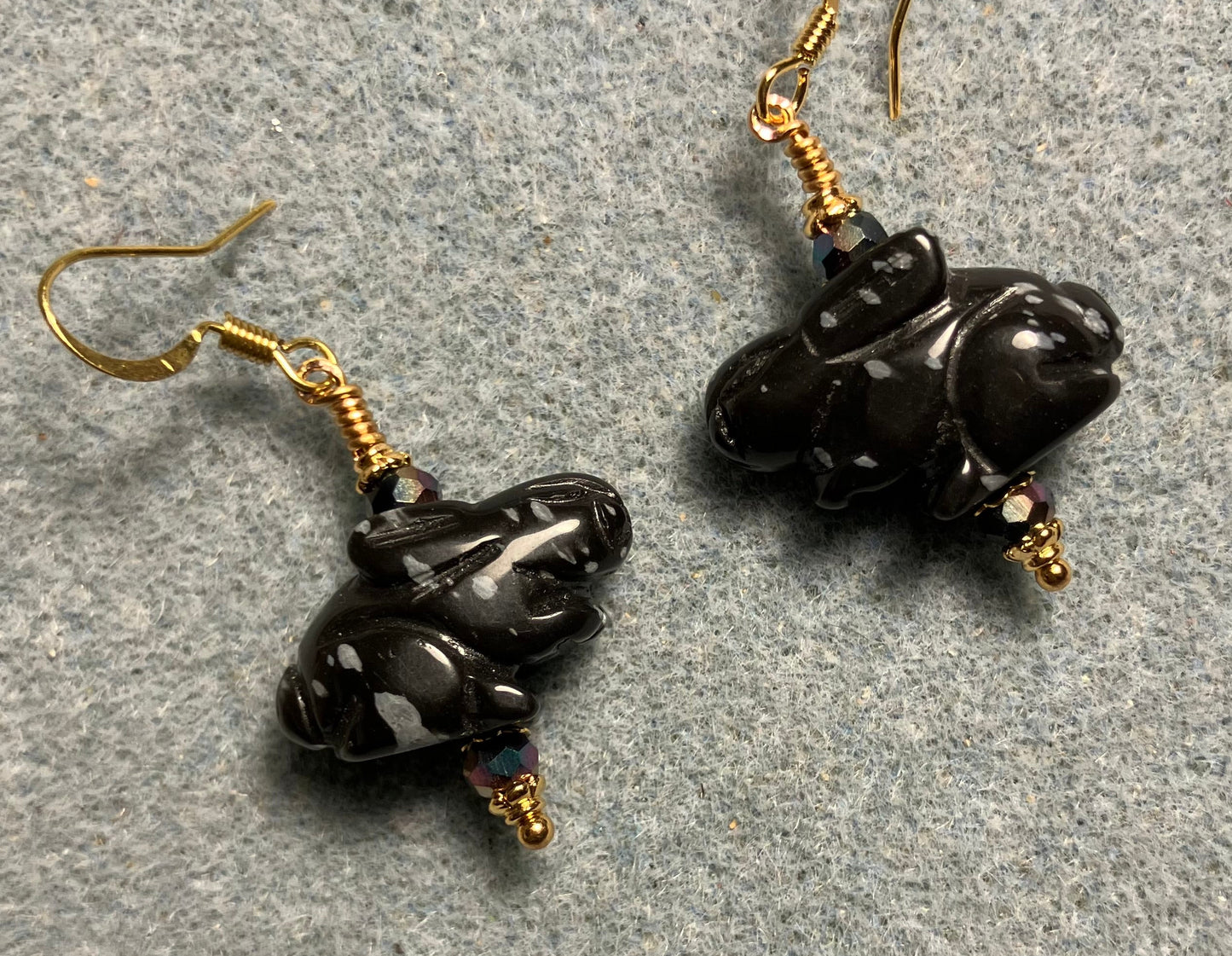 Snowflake obsidian gemstone rabbit bead earrings adorned with black Chinese crystal beads.