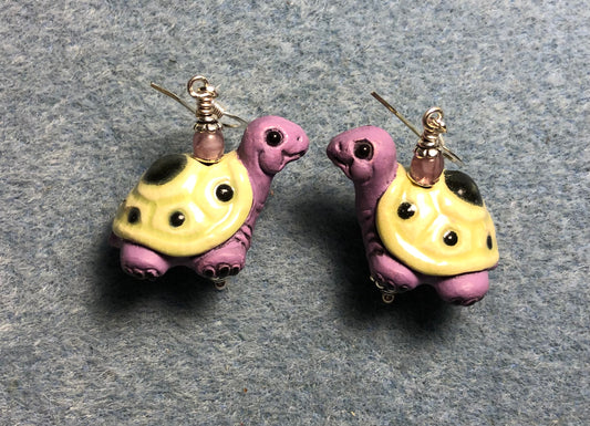 Large violet and light yellow ceramic turtle bead earrings adorned with violet Czech glass beads.