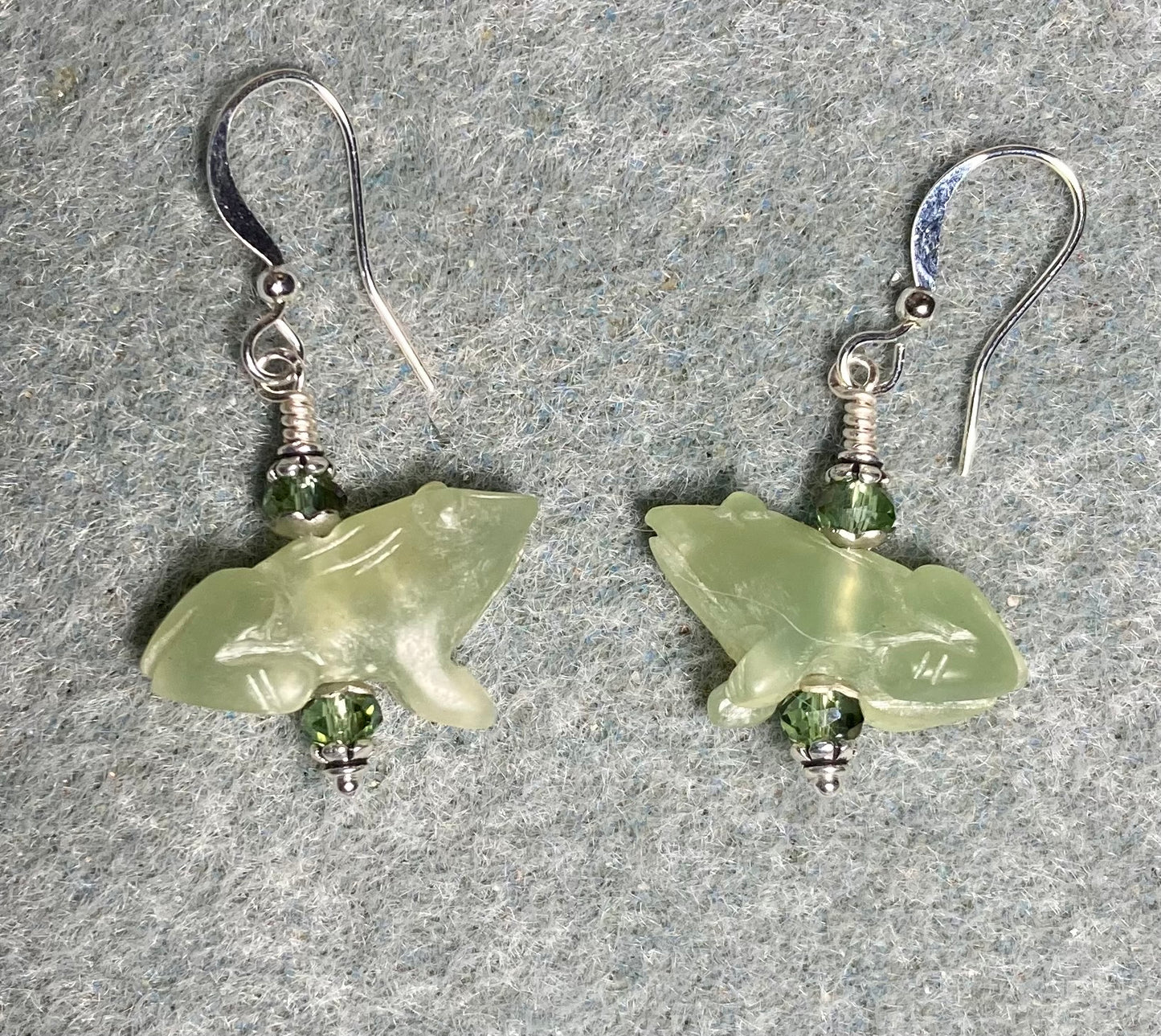 Carved green new jade gemstone frog bead earrings adorned with sparkly light green Chinese crystal beads.