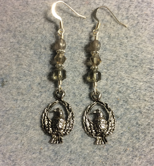 Silver eagle charm earrings adorned with gray Czech glass beads