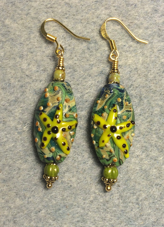 Lime green lamp work starfish bead earrings adorned with lime green Czech glass beads.