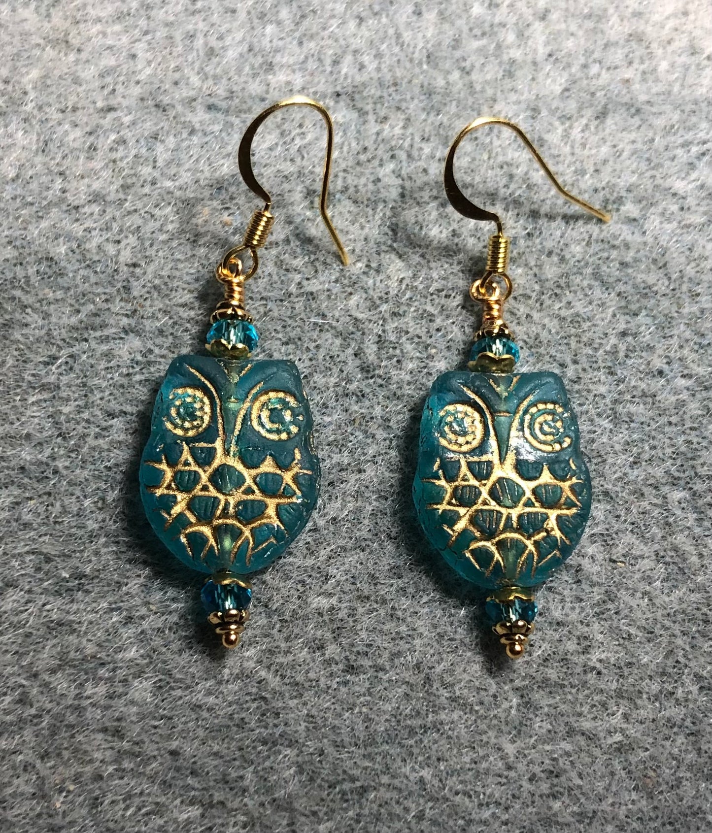 Turquoise (with gold wash) Czech glass owl bead earrings adorned with turquoise Chinese crystal beads.
