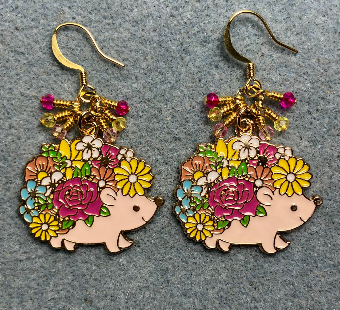 Light pink, yellow, and hot pink enamel porcupine charm earrings adorned with tiny dangling light pink, yellow, and hot pink Chinese crystal beads.