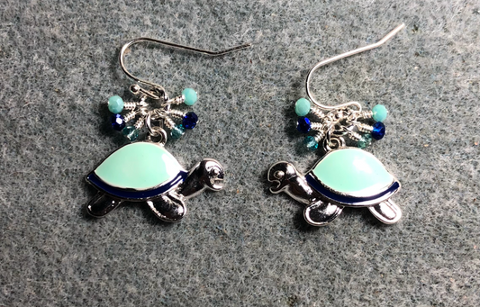 Turquoise and dark blue enamel turtle charm earrings adorned with tiny dangling turquoise and dark blue Chinese crystal beads.