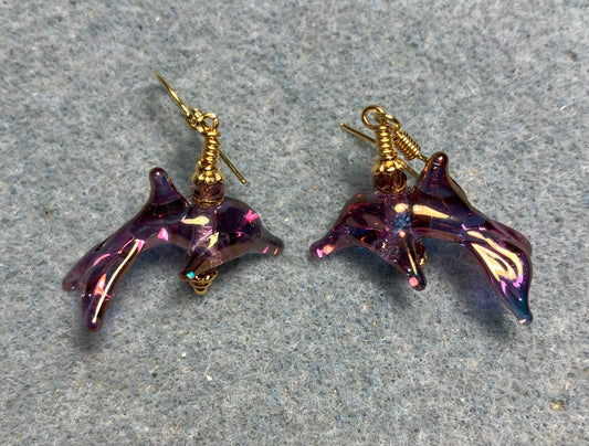 Tiny aurora borealis violet lamp work dolphin bead earrings adorned with tiny violet Chinese crystal beads.