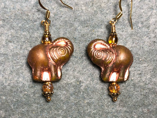 Amber (with copper inlay) Czech glass elephant bead earrings adorned with amber Czech glass beads.