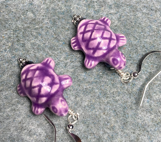 Purple ceramic turtle bead earrings adorned with purple Chinese crystal beads.