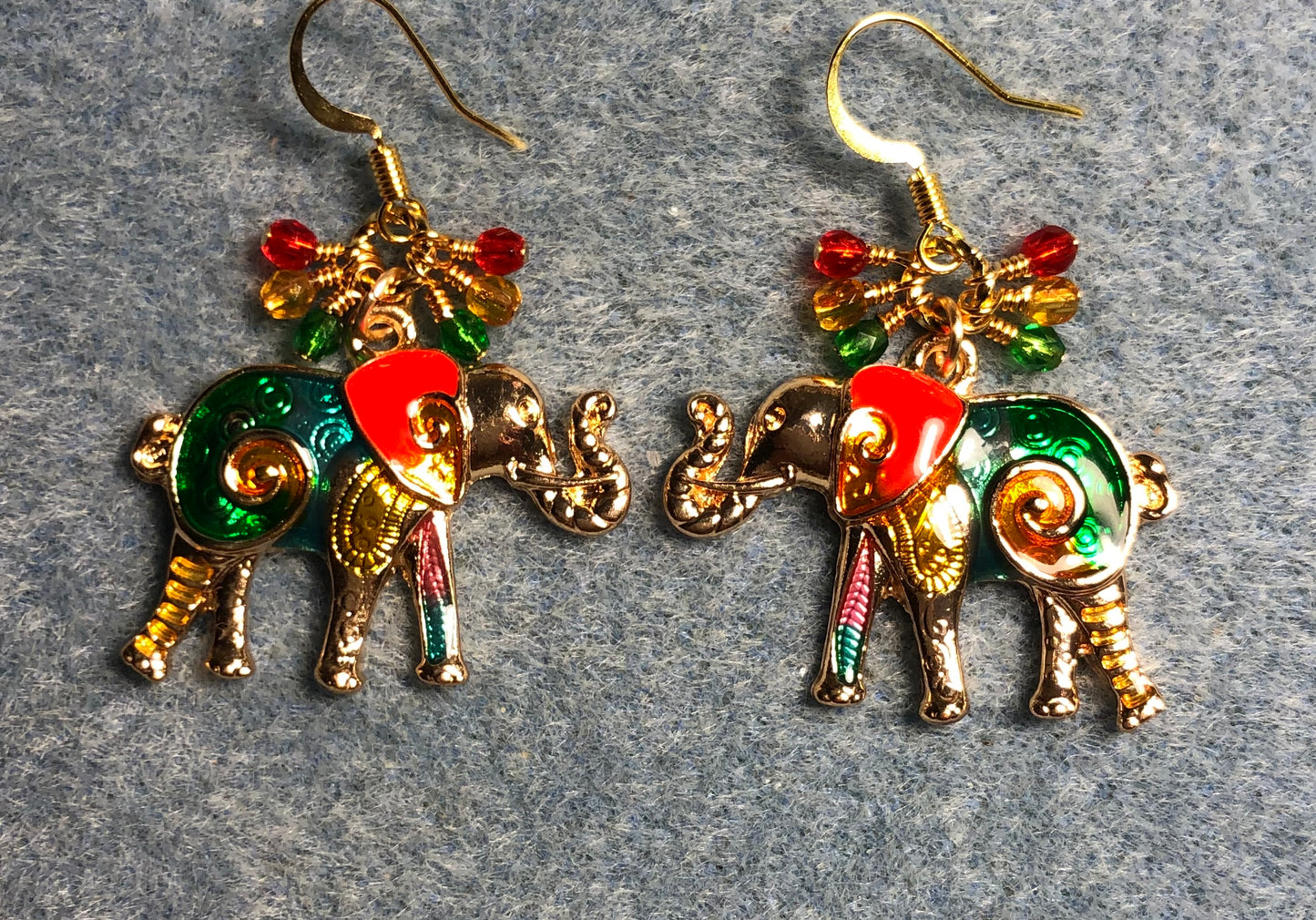 Red, amber, and green enamel elephant charm earrings adorned with small dangling red, amber, and green Czech glass beads.