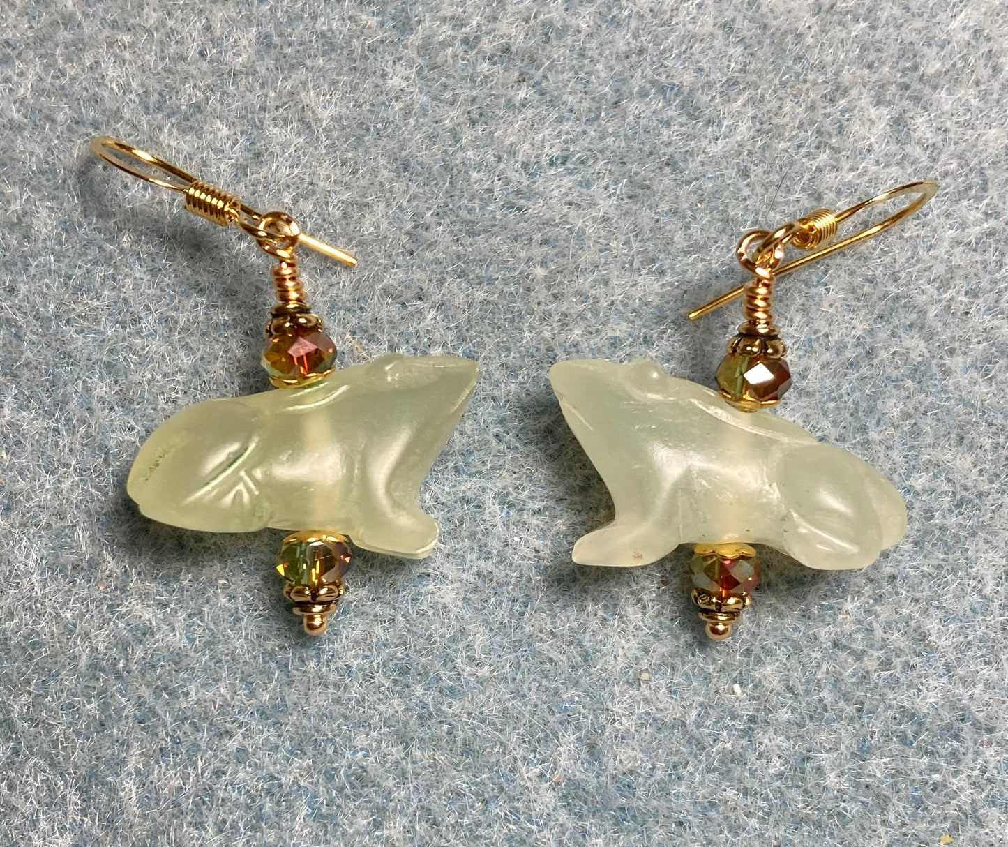 Light green new jade gemstone frog bead earrings adorned with sparkly green Chinese crystal beads.