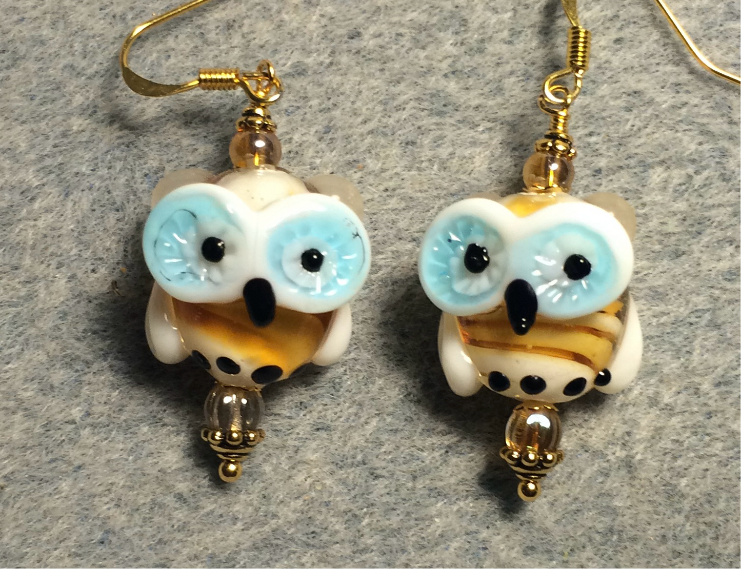 Amber and turquoise lamp work owl bead earrings adorned with amber Czech glass beads.
