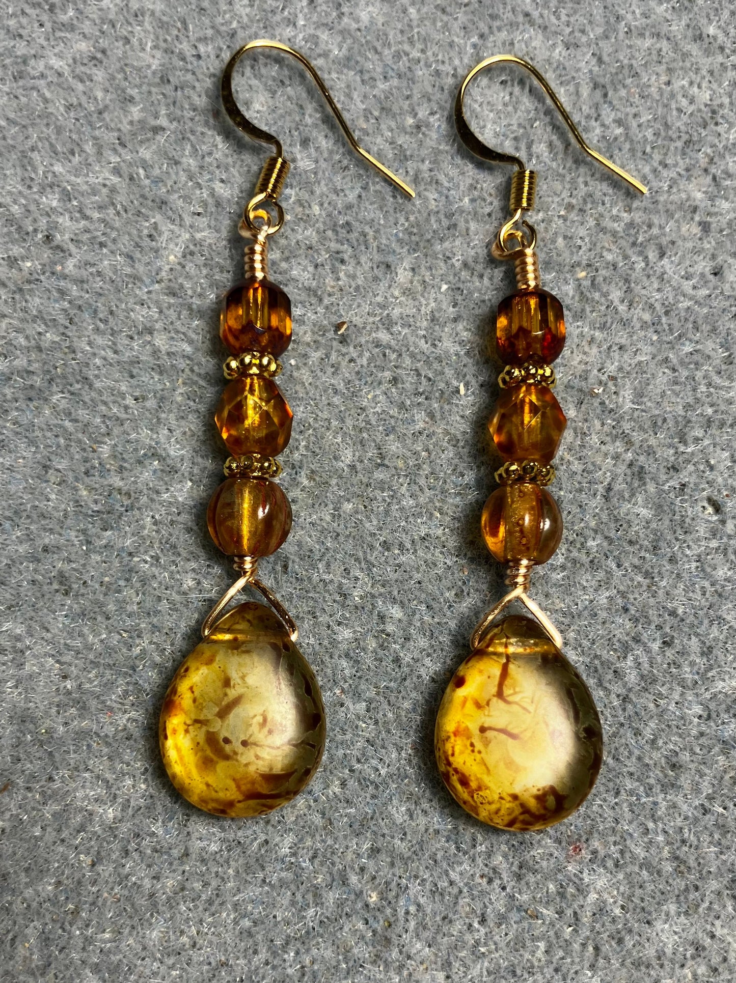 Amber brown Czech glass pear drop bead earrings adorned with amber Czech glass beads.