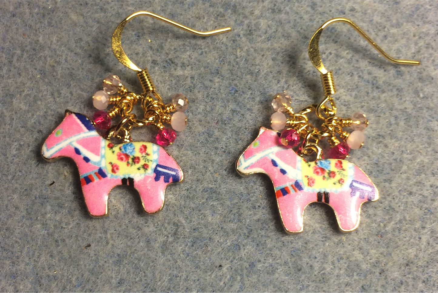 Pink and yellow enamel horse charm earrings adorned with tiny dangling hot pink and light pink Chinese crystal beads.