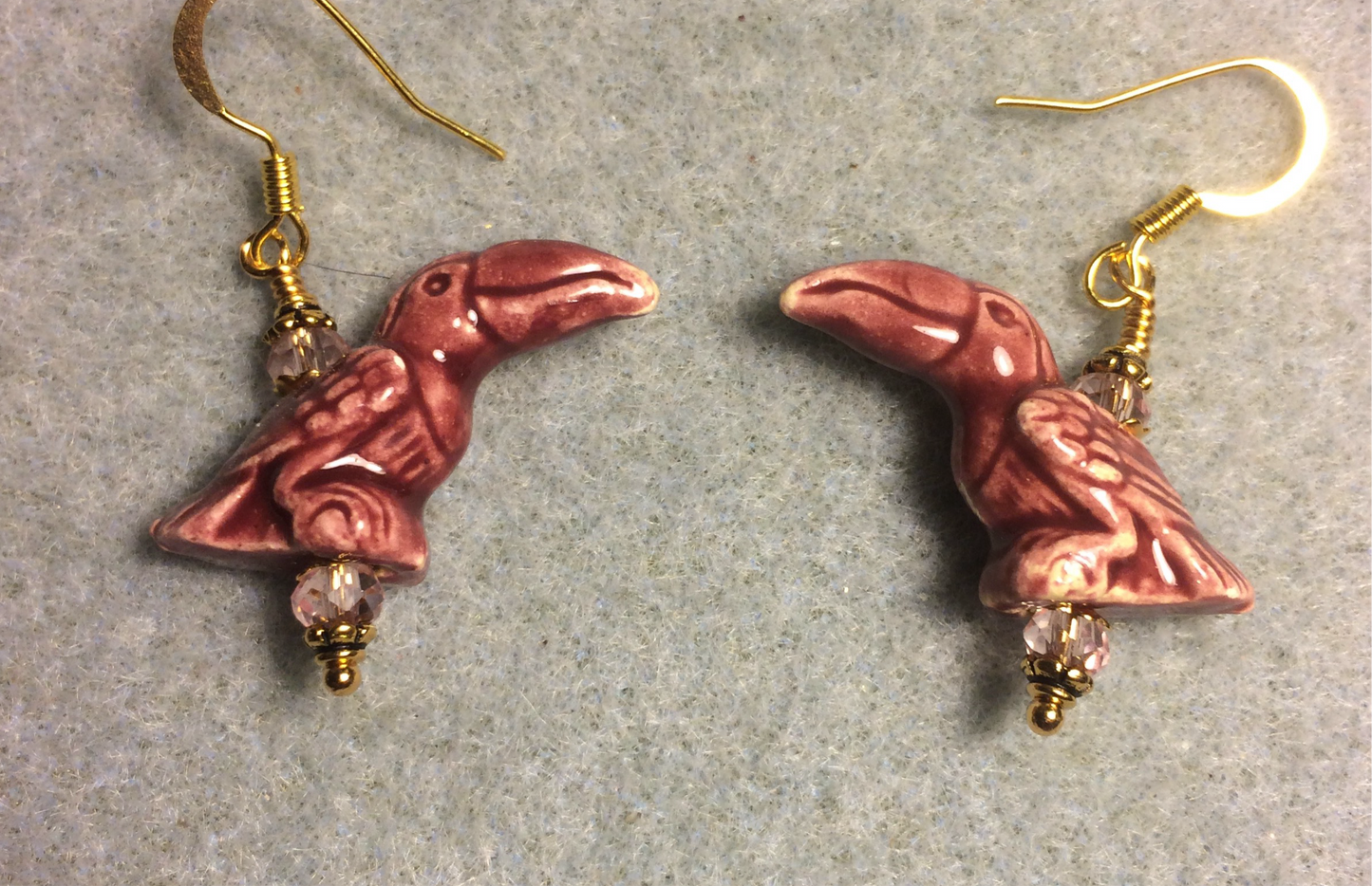 Rose ceramic toucan bead earrings adorned with rose pink Chinese crystal beads.