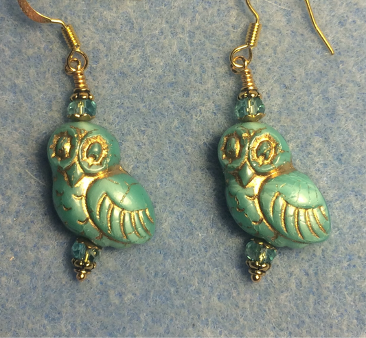 Turquoise (with gold wash) fancy Czech glass owl bead earrings adorned with turquoise Chinese crystal beads.