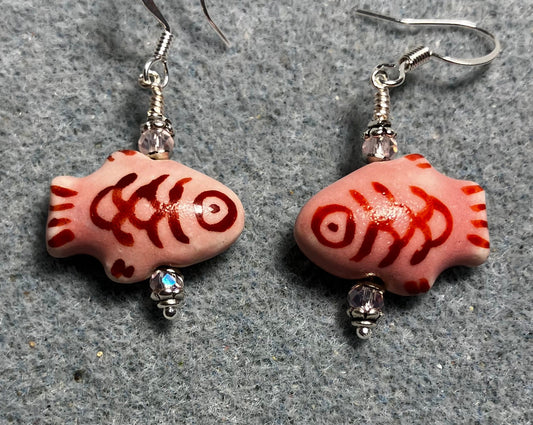 Pink and dark red ceramic fish bead earrings adorned with pink Chinese crystal beads.