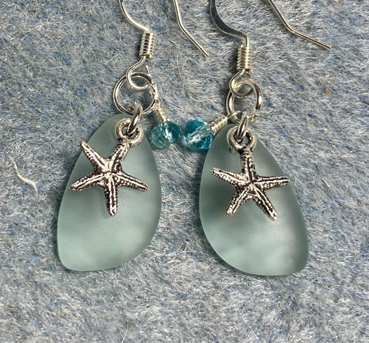 Small light green sea glass pendant bead earrings adorned with small silver starfish charms and light aqua Chinese crystal beads.