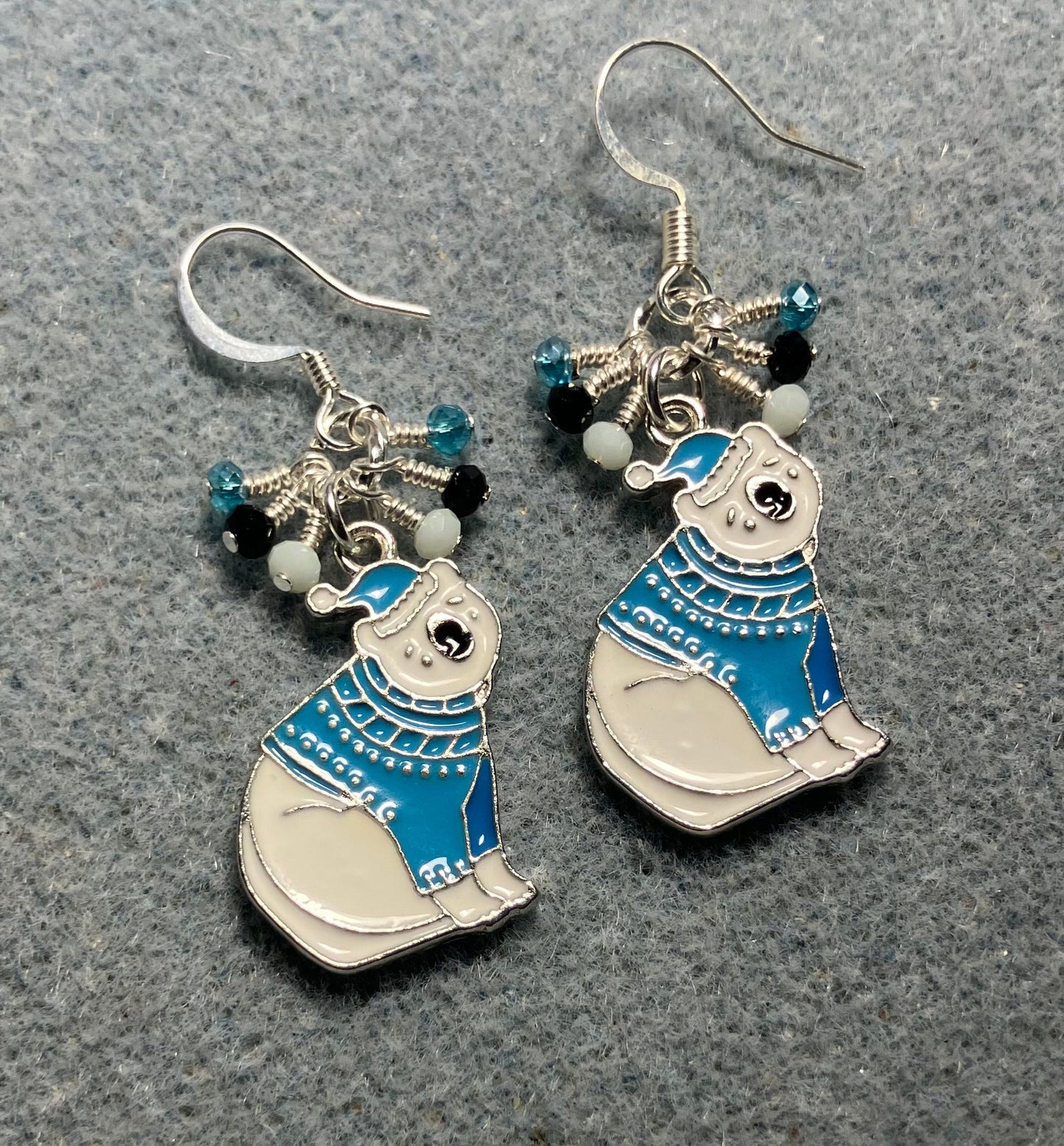 White and turquoise enamel polar bear charm earrings adorned with tiny dangling white, black, and turquoise Chinese crystal beads.