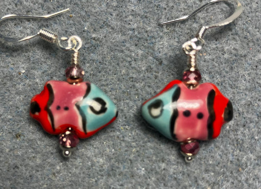 Small pink, red, and turquoise ceramic fish bead earrings adorned with sparkly pink Chinese crystal beads.