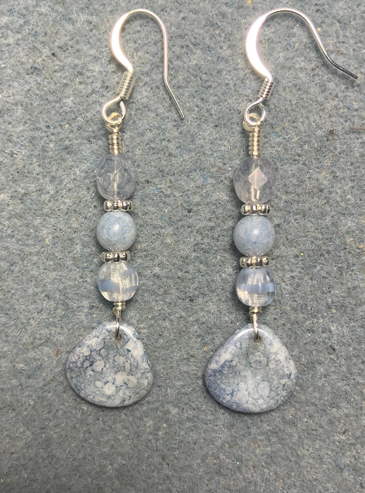Light blue speckled Czech glass rose petal earrings adorned with light blue Czech glass beads.