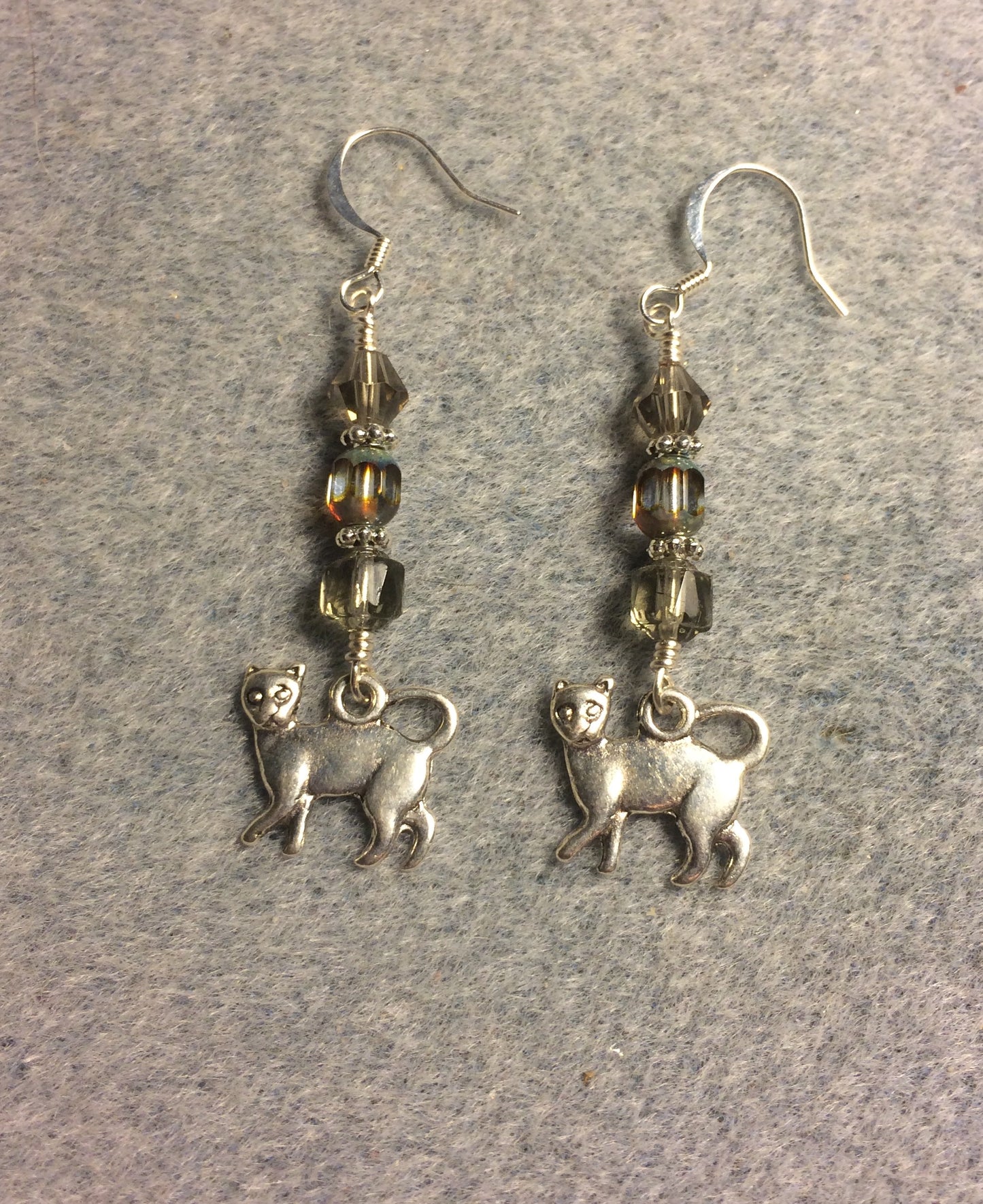 Silver cat charm earrings adorned with gray Czech glass beads