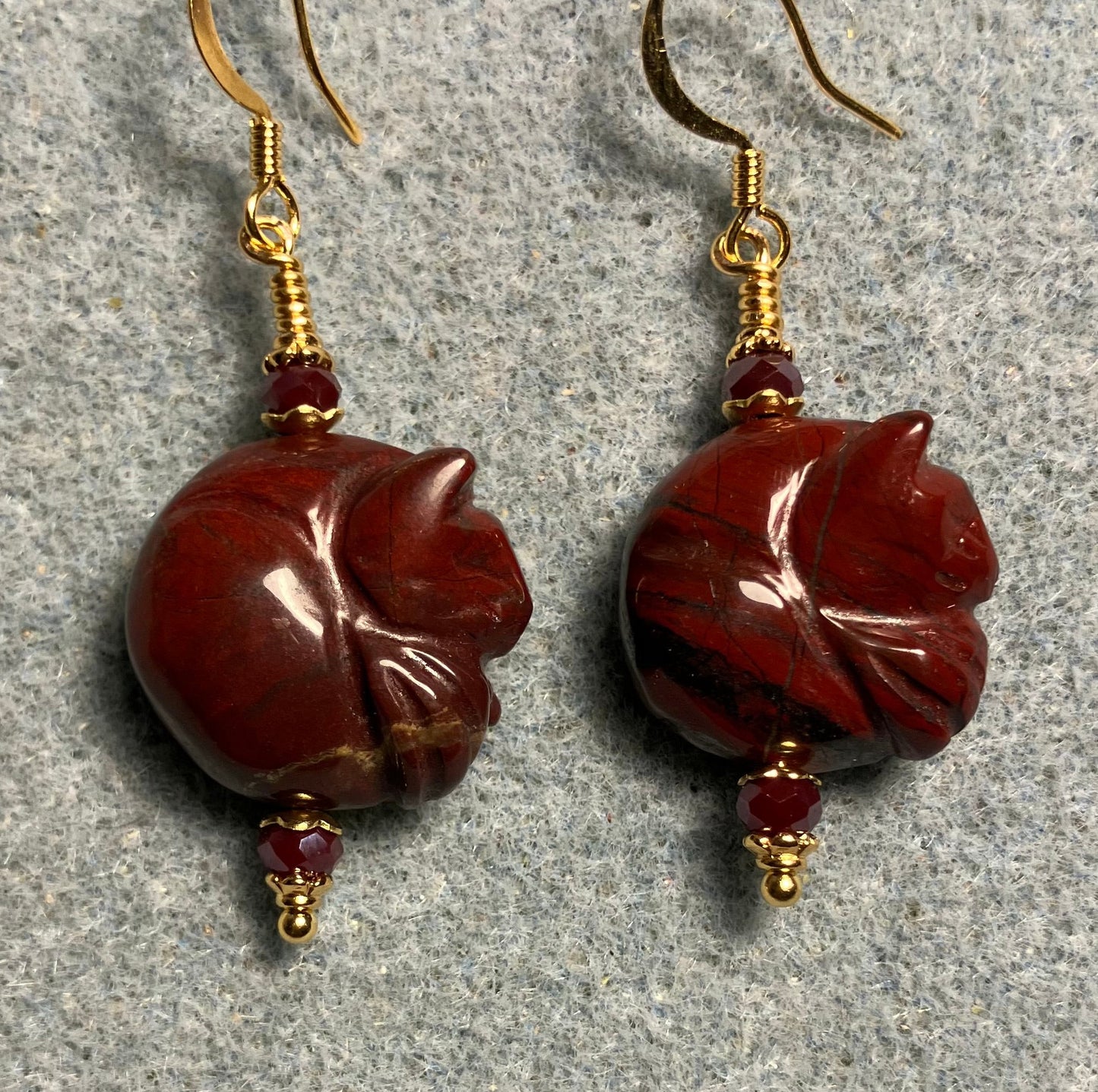 Dark red poppy jasper gemstone sleeping cat bead earrings adorned with dark red Chinese crystal beads.