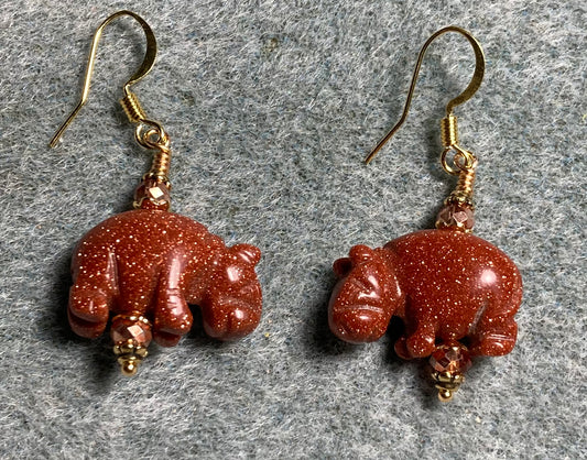 Orange goldstone gemstone hippo bead earrings adorned with orange Chinese crystal beads.