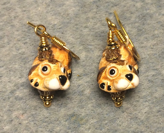 Small tan, black, and white ceramic Bassett hound bead earrings adorned with amber Chinese crystal beads.