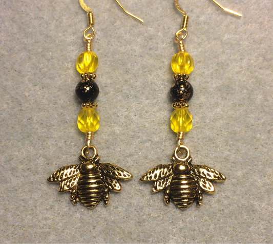 Gold honeybee charm earrings adorned with yellow and black Czech glass beads