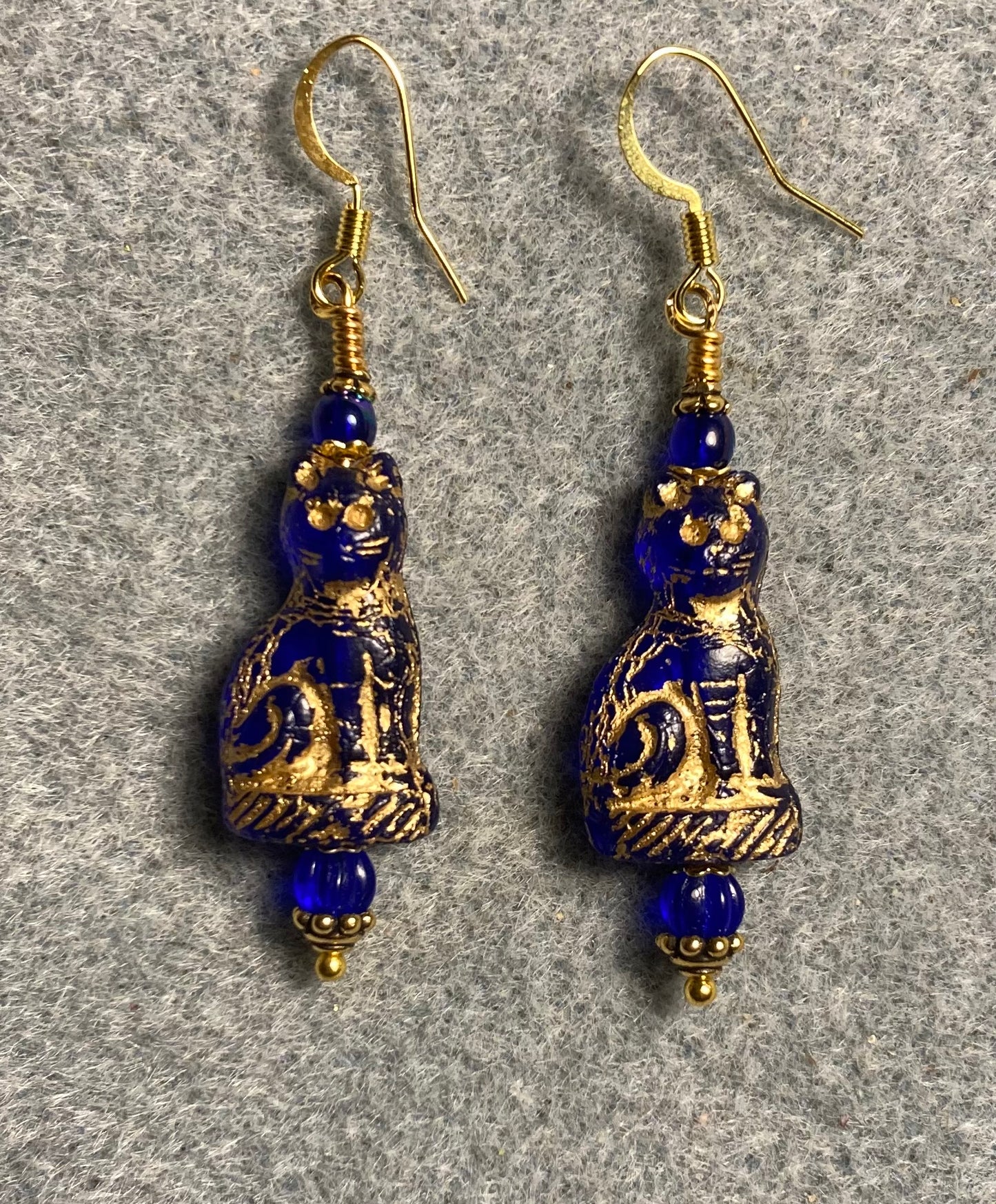 Translucent cobalt blue (with gold inlay) fancy Czech glass cat bead earrings adorned with cobalt blue Czech glass beads.