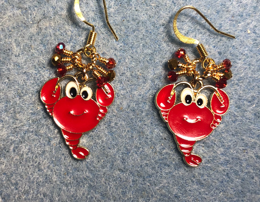 Red enamel lobster charm earrings adorned with tiny dangling red and gold Chinese crystal beads.